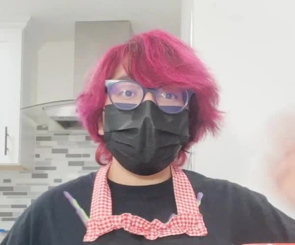 Jelly Bean IRL photo wearing a face mask and glasses in a kitchen