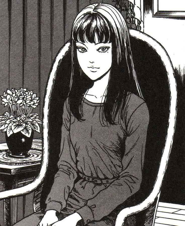Tomie Kawakami manga panel showing her long dark hair and beauty mark under her left eye