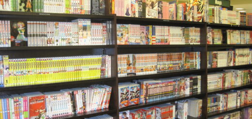 Row of real Japanese manga volumes lined up on a bookstore shelf