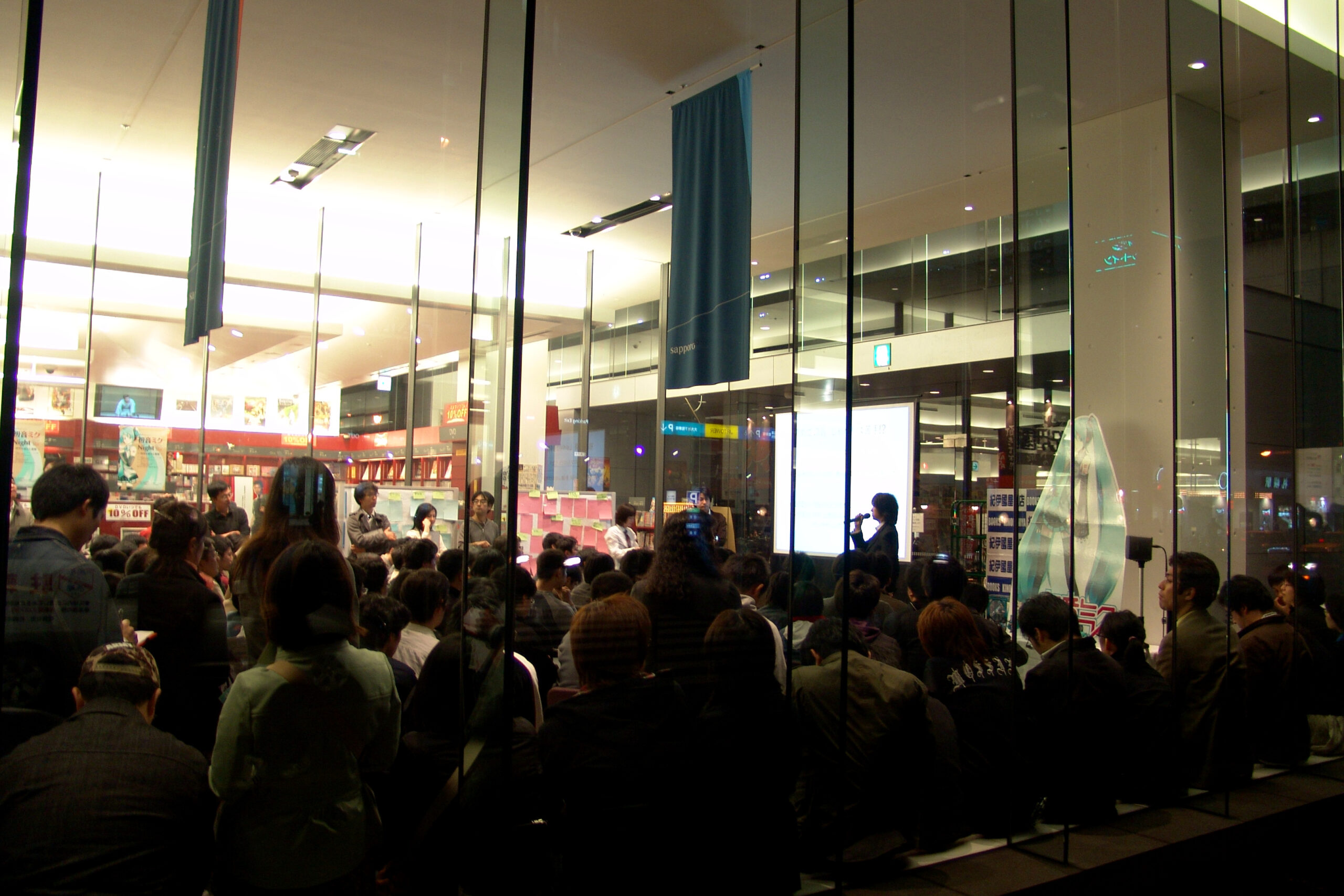 Hatsune Miku performing live as a projected virtual idol at a concert event, an influence on VTubers.